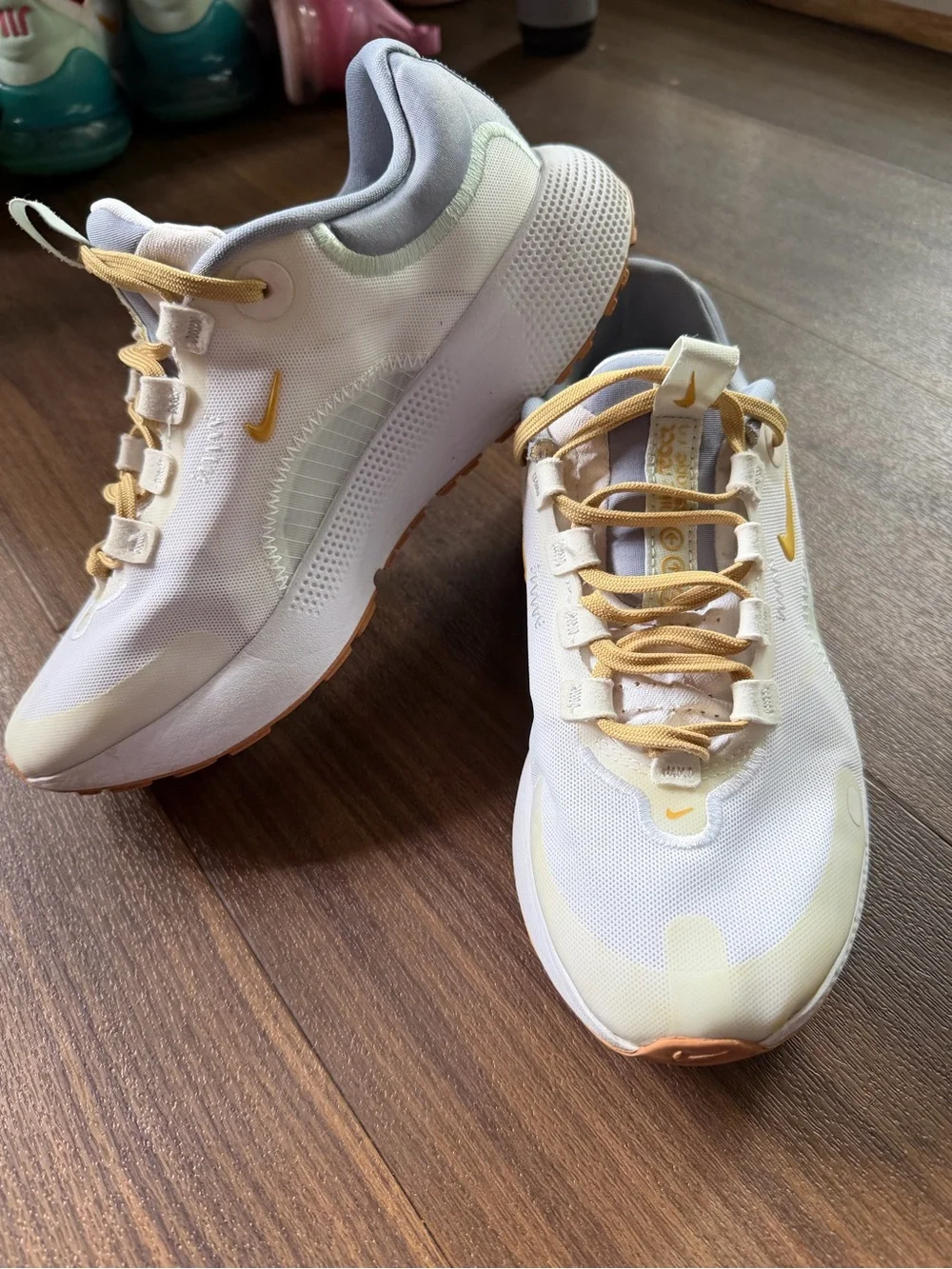 Nike Kids White Sneakers with Pale Yellow Accents